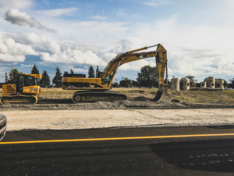 Excavators next to newly built roadway