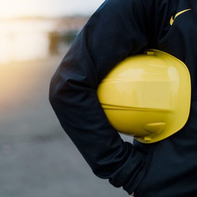 Man holding a construction hard hat representing construction services in tennessee